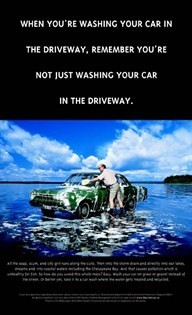 PHoto of man washing car